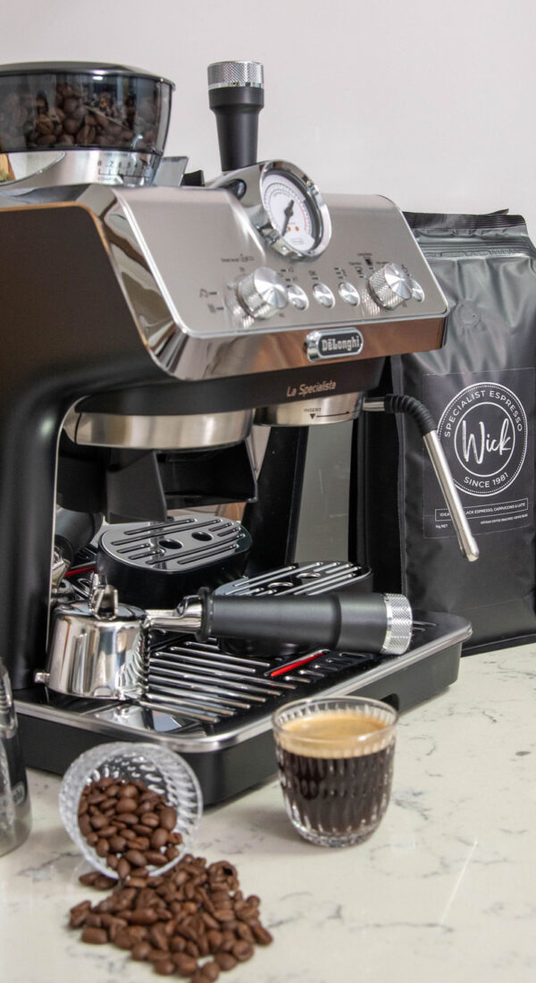 Stylized photo of Wick coffee beans, glass of coffee, coffee making machine and coffee making utensils